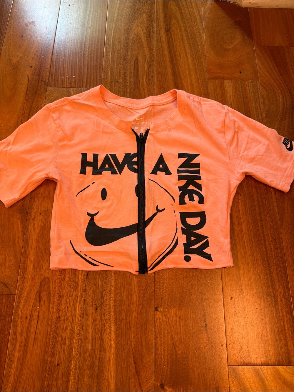 Nike Orange Crop Zip Tee with 'Have A Nike Day' Graphic